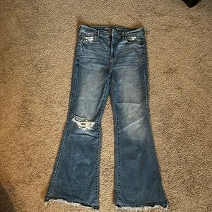 Super high rise flare jeans with distressing